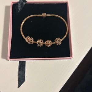 Authentic Pandora rose gold charms with bracelet included